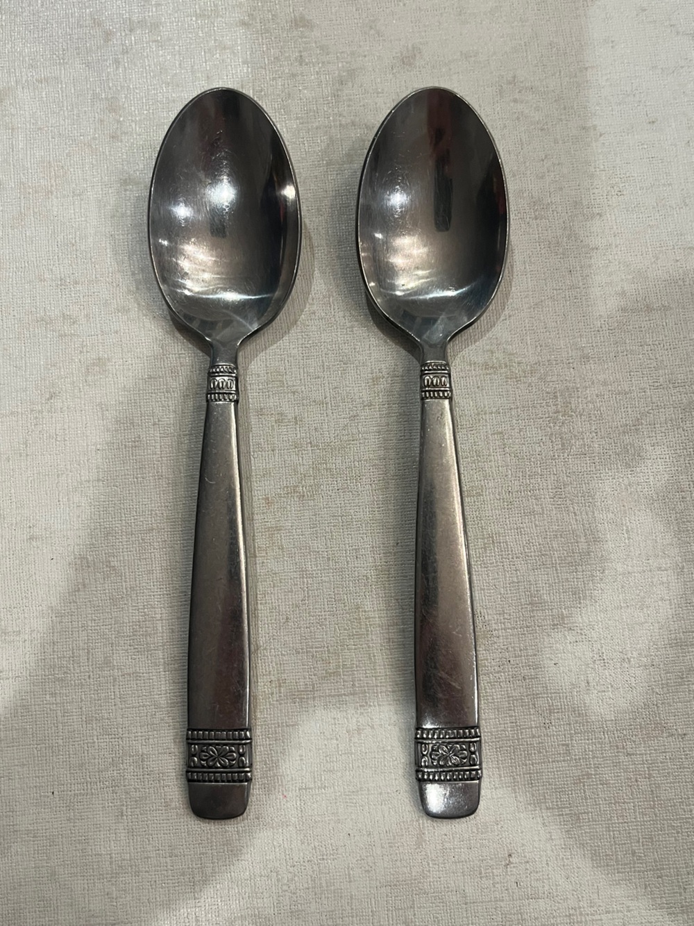 Vintage Oneida Stainless Steel floral band Spoons. Set of 2
